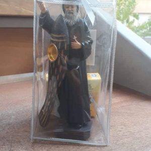 Mar Charbel statue with candle carrier and candle carrier